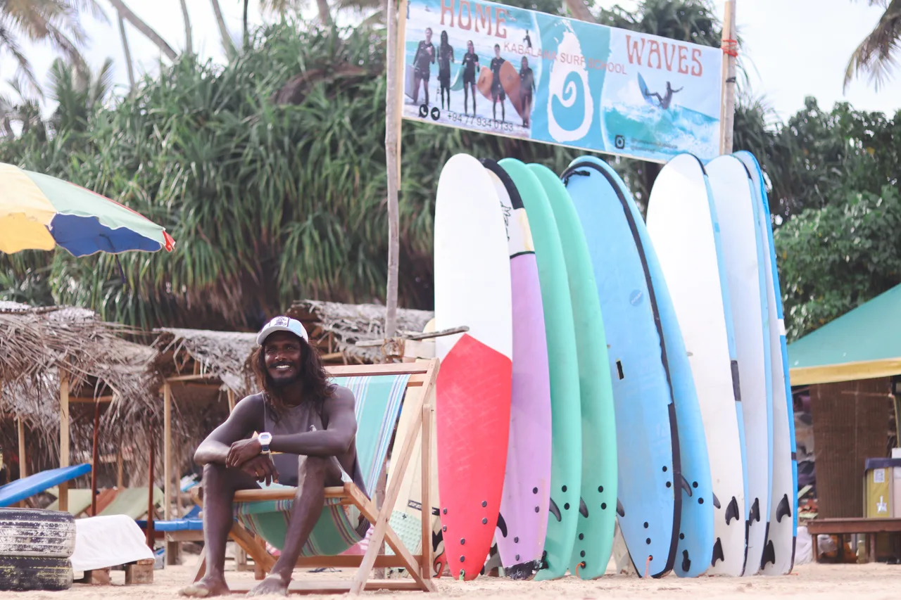 A relaxed moment beside the Home Waves surfboard collection